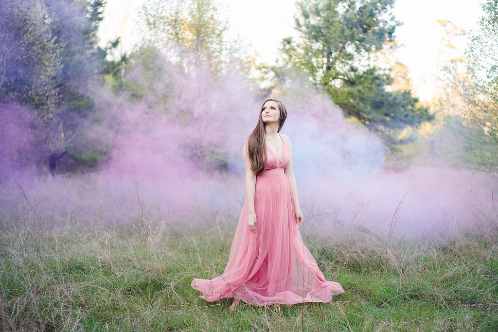 How awesome did this shot come out, I love to experiment with smoke and to create this look I had my assistant run through the background with a blue and red smoke bomb. Pretty fun huh. ;)